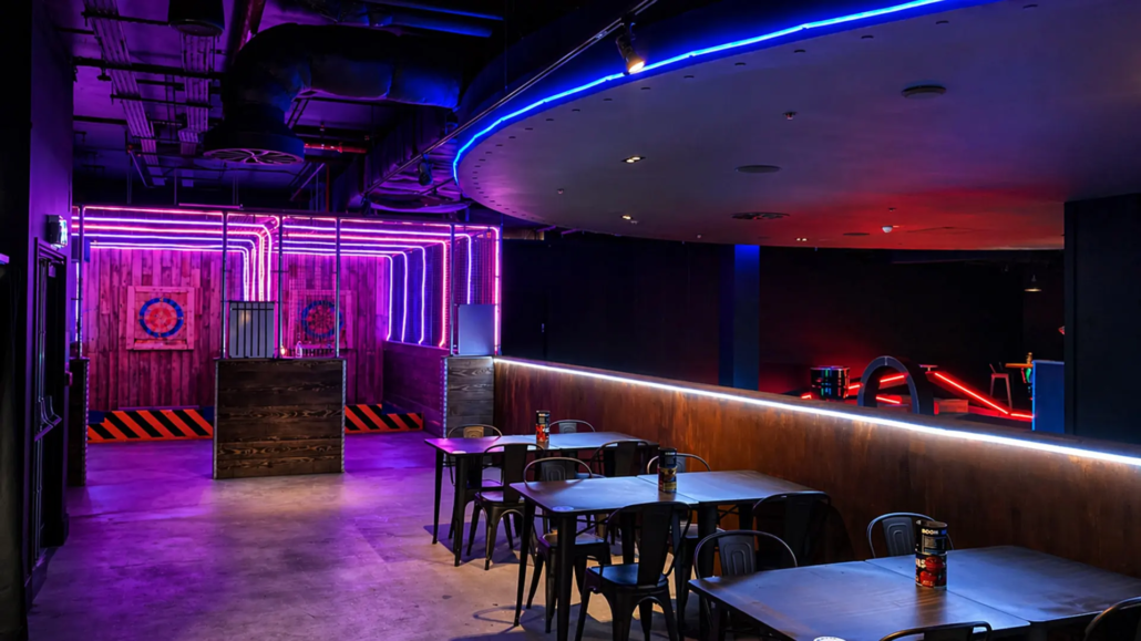 axe-throwing-court-social-bar Social barn concept with axe throwing and lounge area