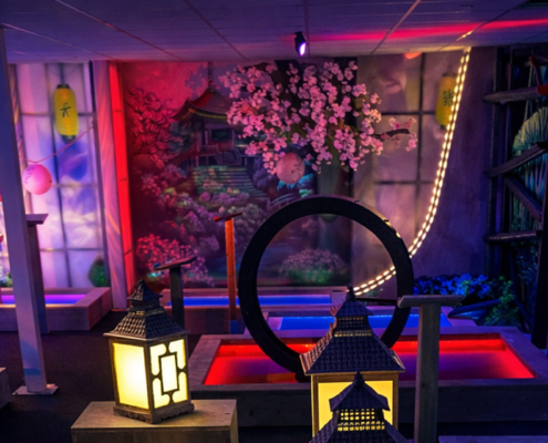 Indoor interactive mini golf with a Sakura theme