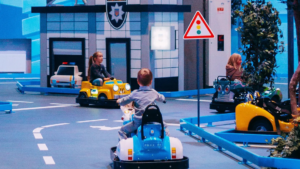driving-school-kids-driving Driving school concept, kids driving small cars